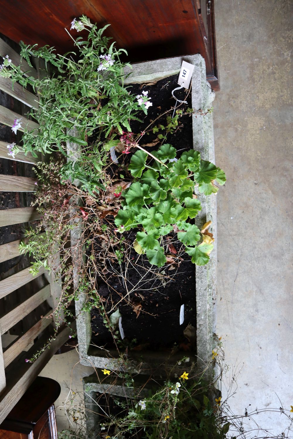 A reconstituted stone rectangular garden planter on trestle stand, length 92cm height 58cm